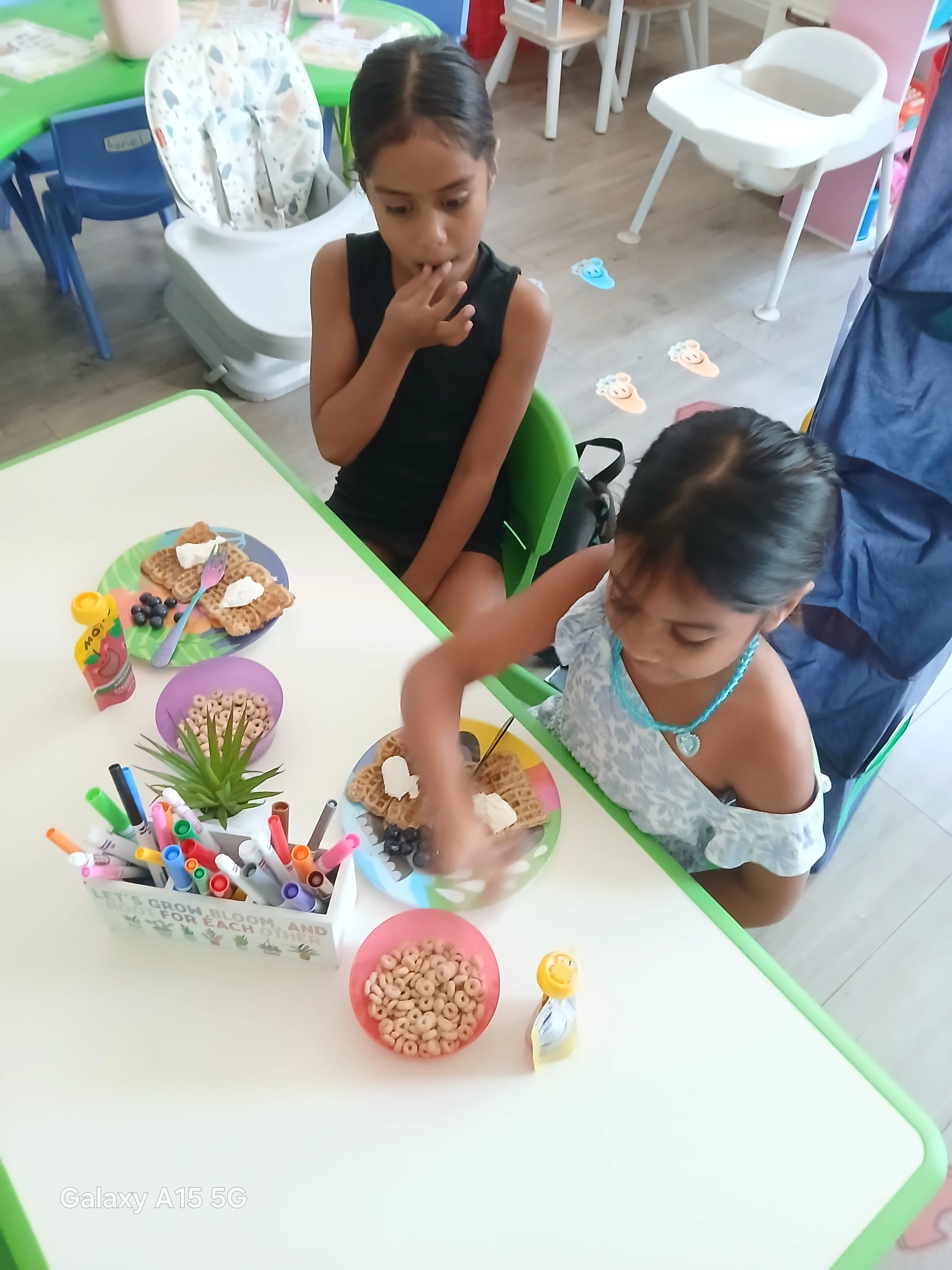Children creating together at the classroom table